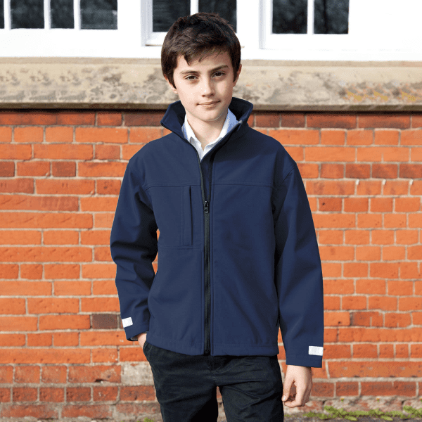 A youth classic softshell jacket in navy, featuring a zip front and a pocket, with a logo present.