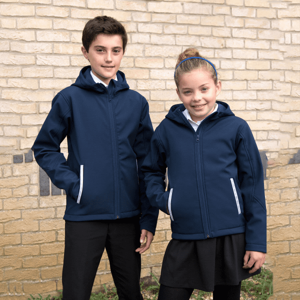 A navy blue softshell jacket with a hood, featuring contrasting white zippers and side pockets, worn by two children.