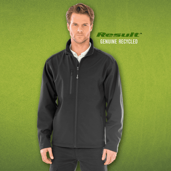 A black softshell jacket is displayed on a model, featuring a zip front and a logo on the left side.