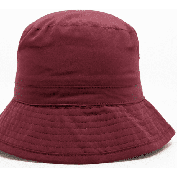 A maroon microfibre bucket hat featuring a wide brim and a textured finish, with a logo on the side.