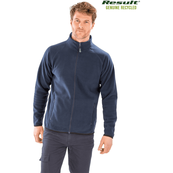 A man wearing a navy blue recycled fleece polarthermic jacket with a zip closure and side pockets, featuring a logo.
