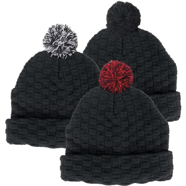 A collection of three black beanies with textured patterns and colourful pom poms—white, red, and black. Each hat features a logo.