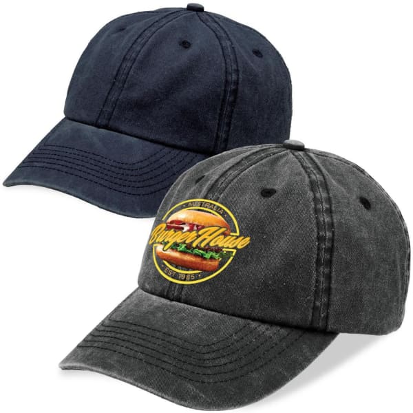 Two washed chino caps in navy and charcoal colours, featuring a logo on the charcoal cap.