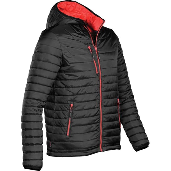 A black puffer jacket with a red interior and accents, featuring a hood and zippered pockets. It has a logo.