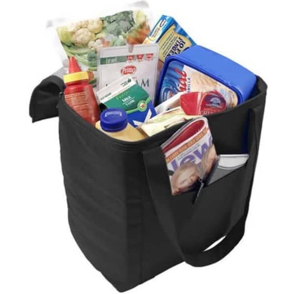 A black non-woven cooler bag filled with groceries, including drinks, condiments, and frozen items.