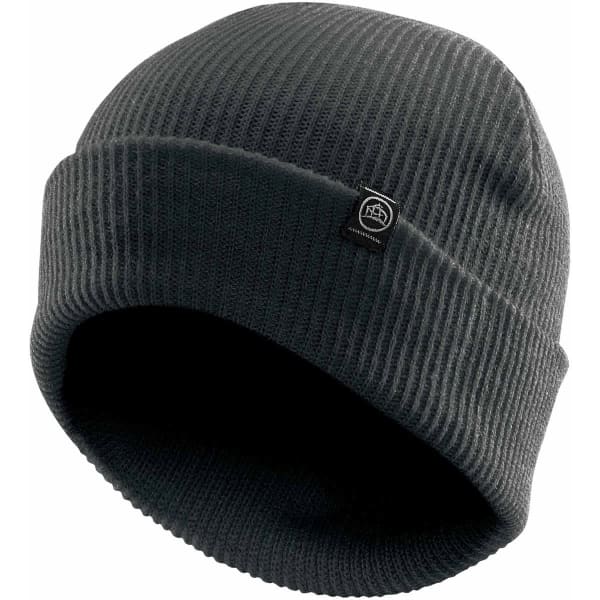 A vintage knit beanie in dark grey with a small logo tag on the side. The fabric features a ribbed texture.