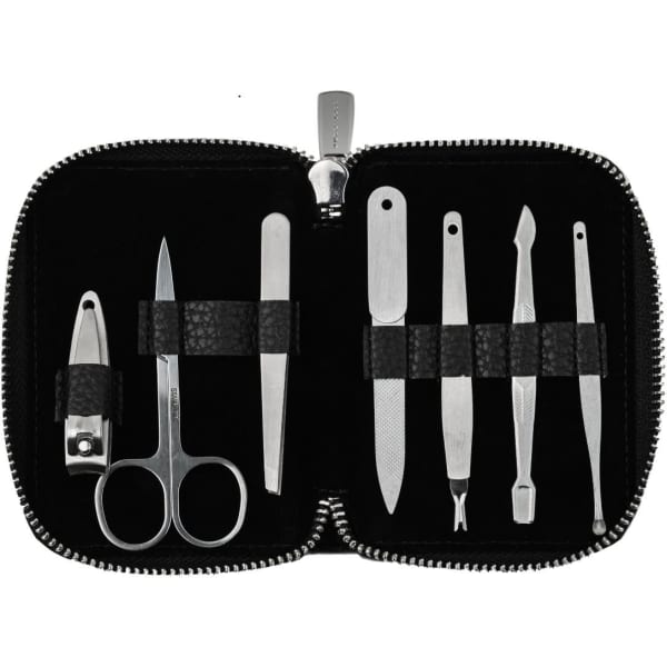 A black manicure set featuring metal tools including scissors, clippers, and various files, contained in a zippered case.
