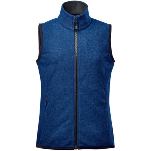 A blue sleeveless vest with a high collar, featuring a front zipper and side pockets. It has a branding logo.