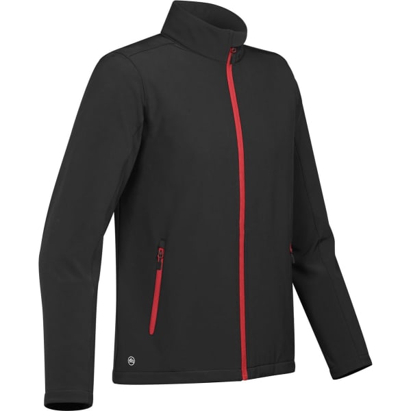 A softshell jacket in black with red zip and accents, featuring side pockets and a high collar.