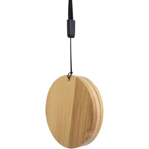A round bamboo cable winder, featuring a hanging cord and a smooth surface.