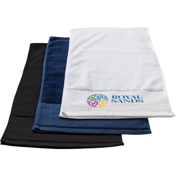 A stack of three gym towels in black, navy blue, and white, featuring a logo on the white towel.