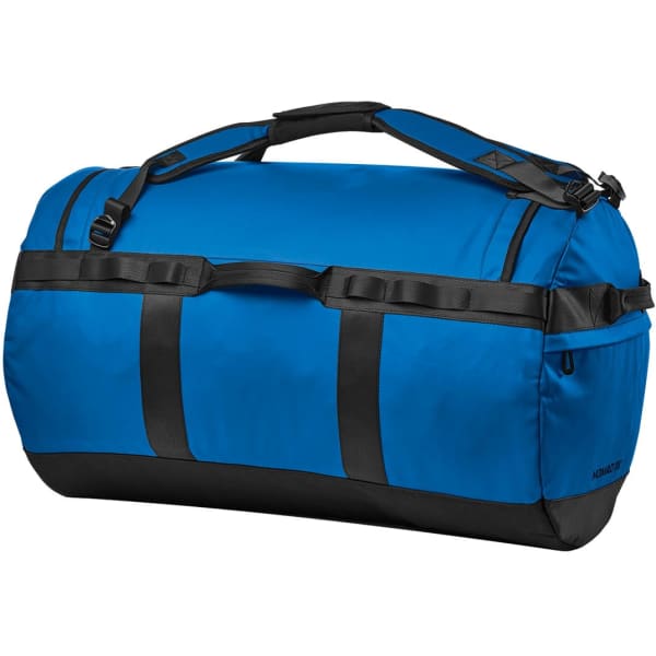 A blue duffle bag with black accents and straps, featuring a logo and sturdy handles.