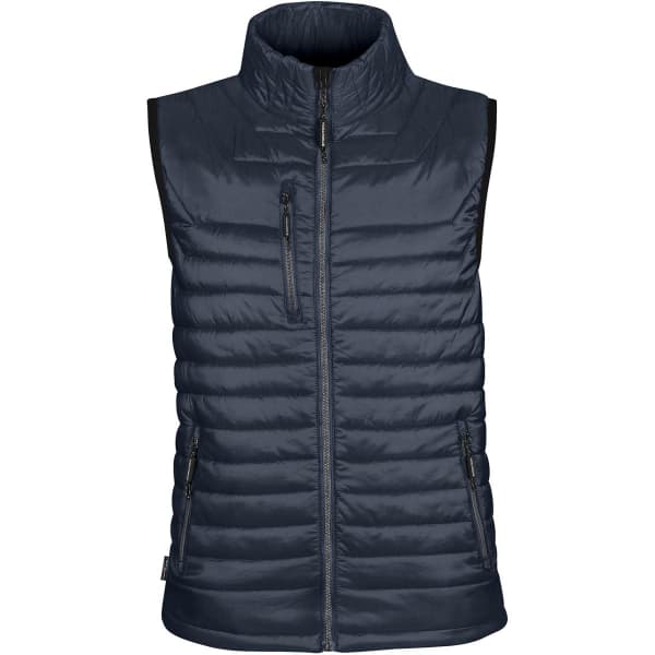 A navy thermal vest with a high collar, featuring zippered pockets and a logo on the chest.