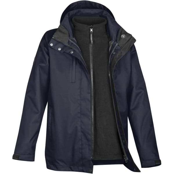 A women's three-in-one parka featuring a navy outer jacket and a black inner fleece layer, with a hood and zipper detailing.