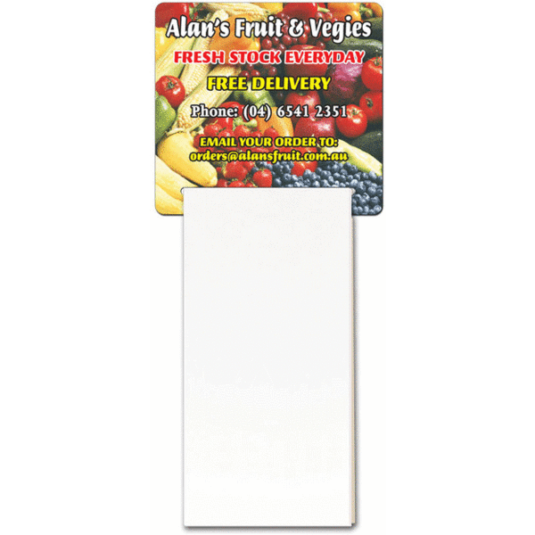 A magnetic calendar featuring a colourful fruit and vegetable design at the top and a blank notepad section below.
