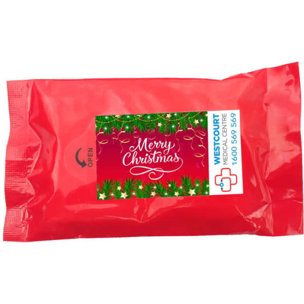 A red packet of alcohol wipes featuring festive decorations and a logo.