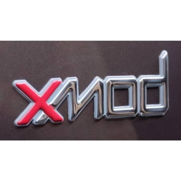 A glossy metallic logo featuring the text "Xmod" in silver and red on a dark background.