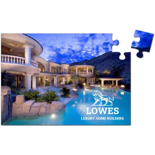 A jigsaw puzzle featuring a luxurious home with a swimming pool, surrounded by greenery, set during twilight.