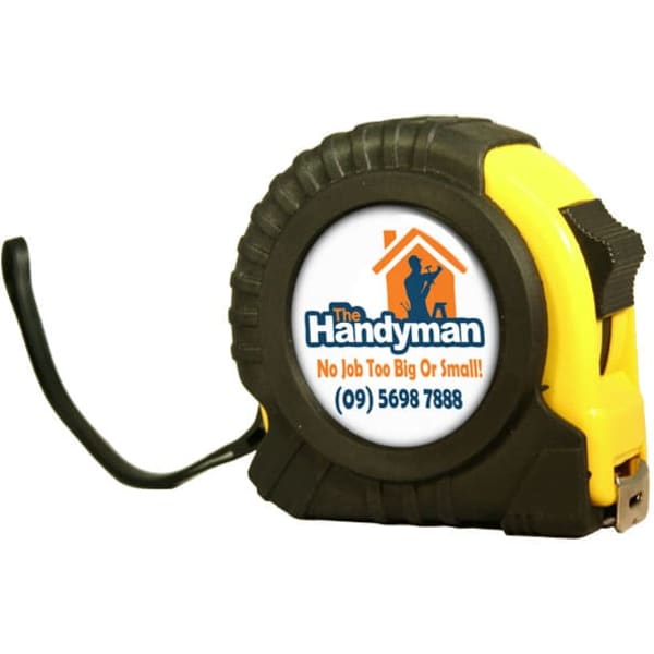 A yellow and black dome tape measure with a logo on the front, featuring a sturdy design and a measuring tape.