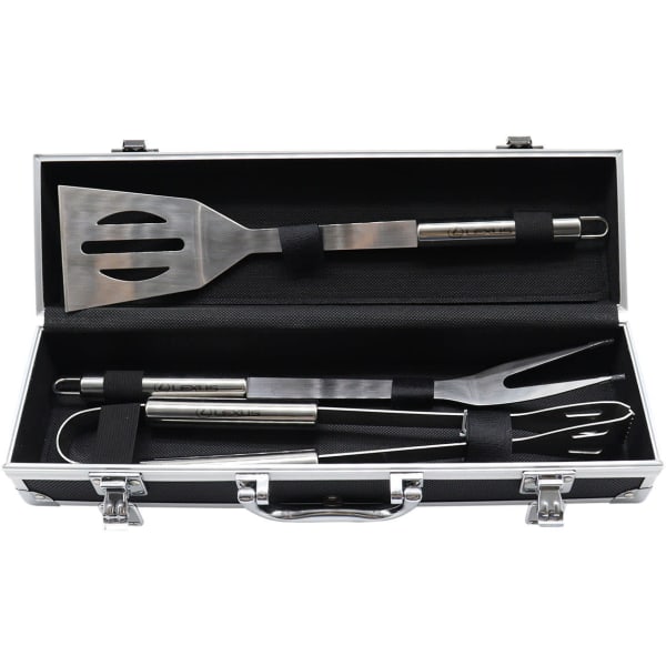 A stainless steel BBQ set with spatula, fork, and tongs in a sleek black deluxe case.