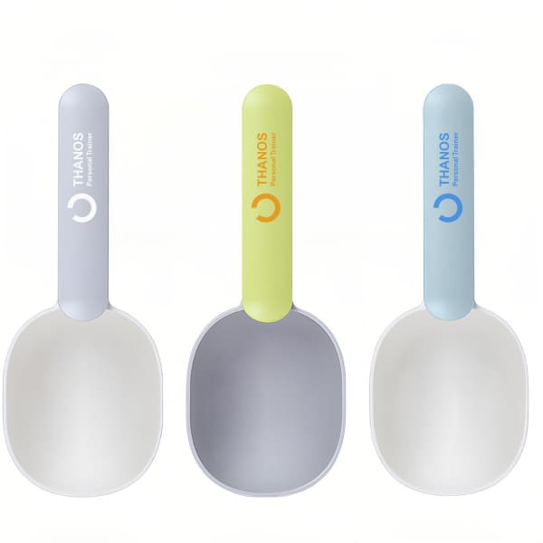 Three 2 in 1 pet food scoops in pale grey, lime green, and light blue, each with a logo on the handle.