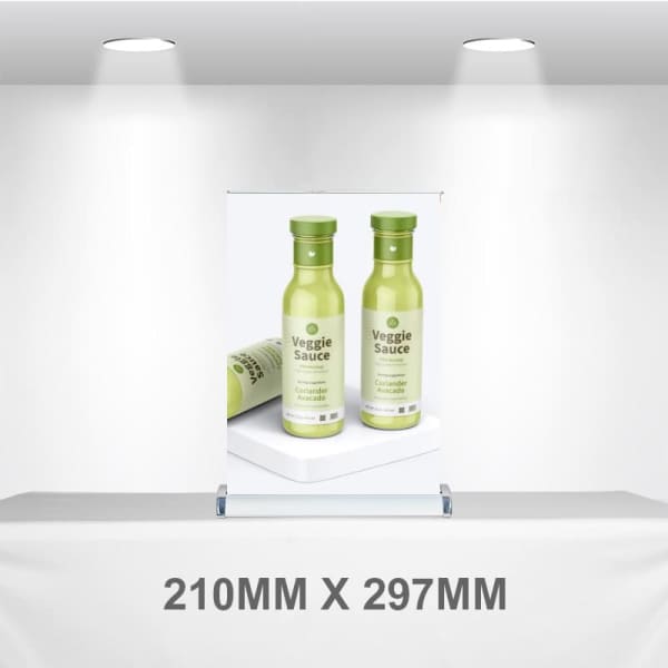 A pull-up banner displaying two green bottles of Veggie Sauce, set against a neutral background.