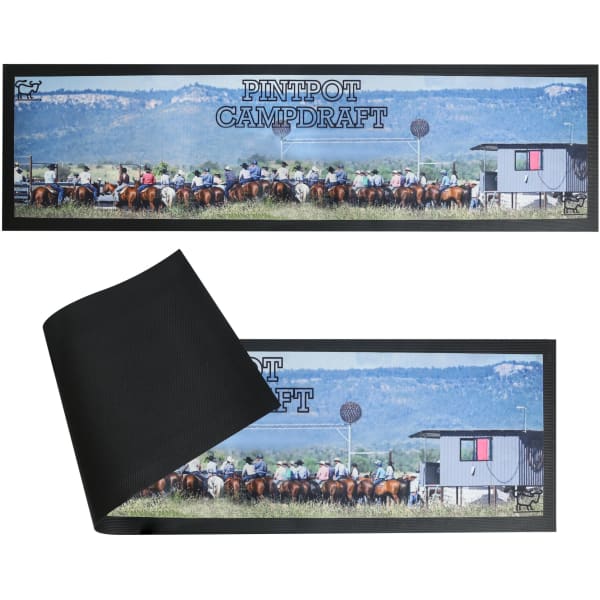 A long counter mat featuring a horse event scene with a black underside. It includes a logo and vibrant colours.