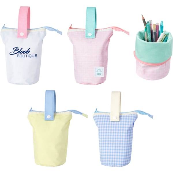 A foldable pencil case with handle in pastel colours: pink, yellow, and mint, featuring a logo.