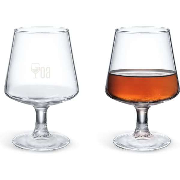 A brandy snifter in clear glass, with one empty and one filled with amber liquid, featuring a logo.