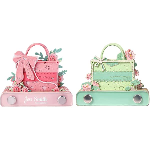 A 3D paper art handbag notepad featuring pink and green designs with floral embellishments and a logo.