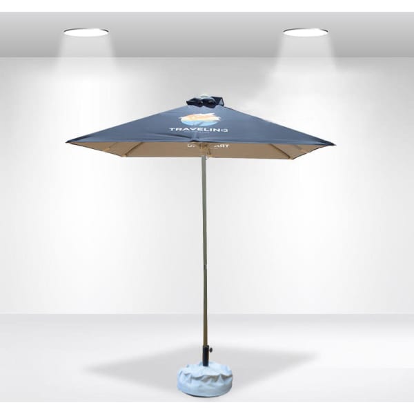 A square patio umbrella with a blue canopy and a light blue base, featuring a logo on the top.