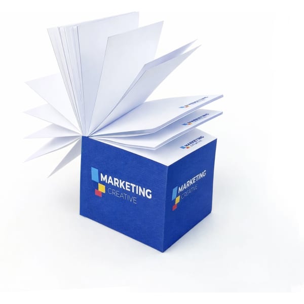 A blue cube-shaped notepad with white sticky notes and a logo on one side.
