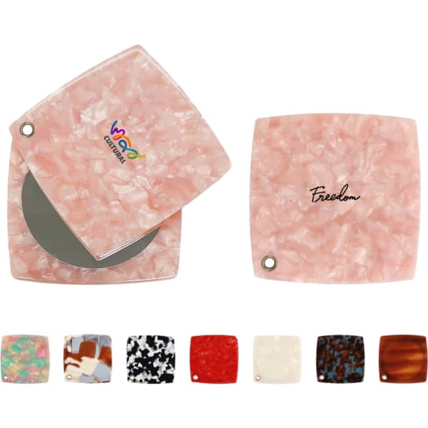 A pink acetate vanity mirror with a square design, featuring a reflective surface and a branding logo.