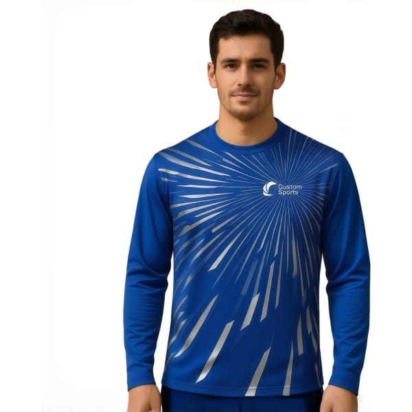 A blue long-sleeved shirt featuring a dynamic pattern and a logo. Made from 100% Poly Milk Silk.