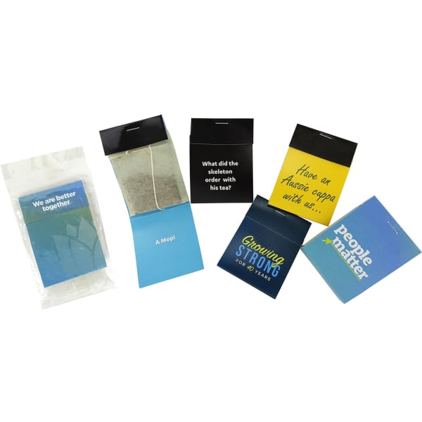 A collection of tea cards in various colours, featuring a tea bag and a packet with branding.