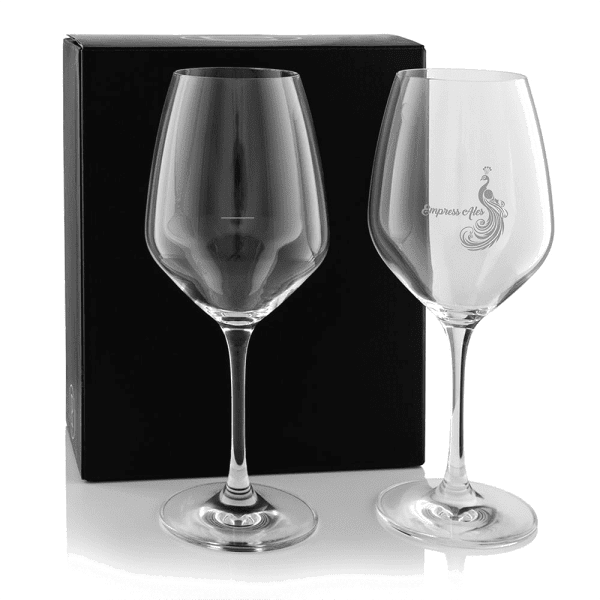 A twin pack of elegant wine glasses in clear glass, presented in a black box. One glass features a logo.