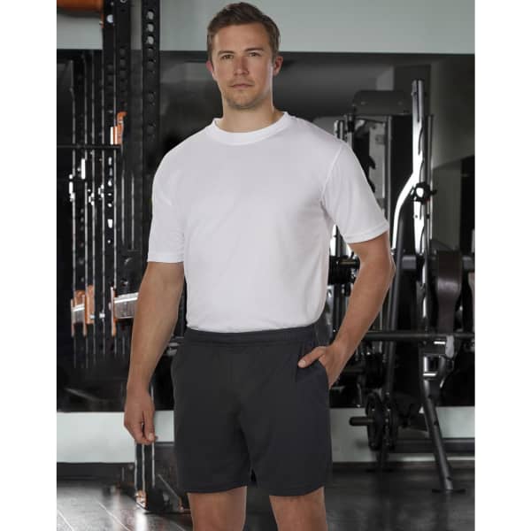 Adults' bamboo charcoal sports shorts in black, featuring an elastic waistband and side pockets. Model wearing a white shirt.
