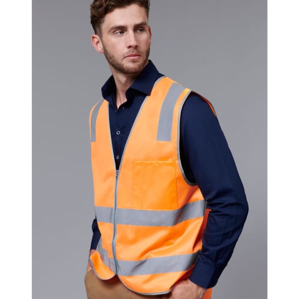 An orange safety vest with reflective stripes worn over a dark blue shirt, featuring a pocket and a logo.