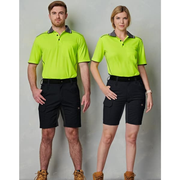 A pair of models wearing bright green polo shirts and black Rip-Stop Poly/Cotton Stretch Work Shorts.