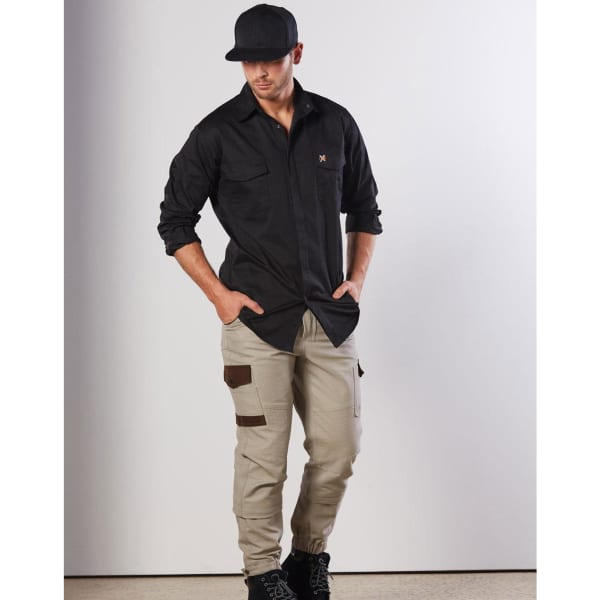 A model wearing a black long-sleeve work shirt and beige cargo pants, featuring two chest pockets and a logo.