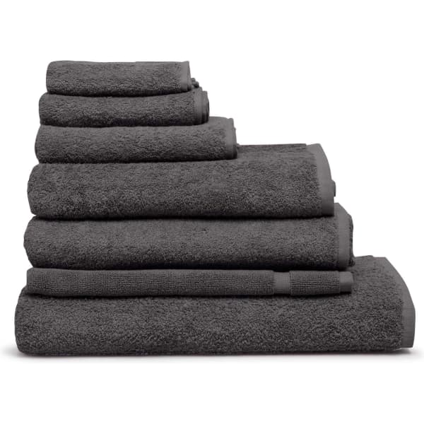 A stack of grey towels in various sizes, showcasing a plush texture and a simple design. The image includes branding.