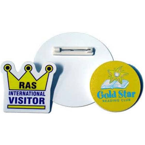 A set of two plastic badges; one is yellow with a star logo, the other is a multicoloured badge with a crown design.