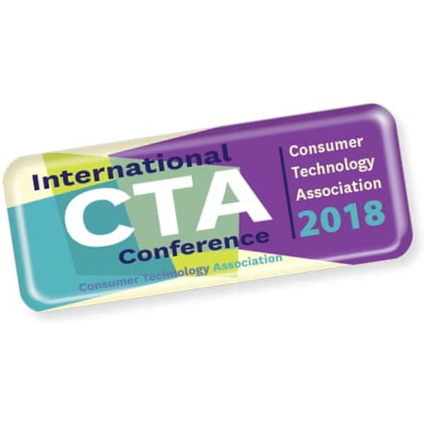 A rectangular sticker in purple, green, and yellow, featuring the text 