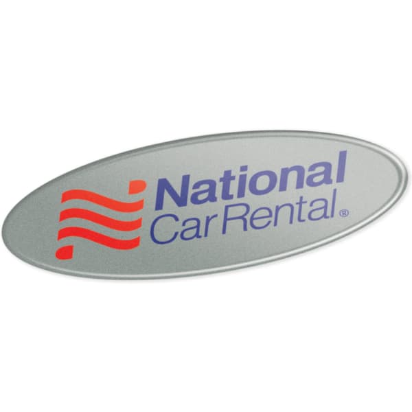 An oval resin-coated label in silver with a blue and red logo and text for National Car Rental.