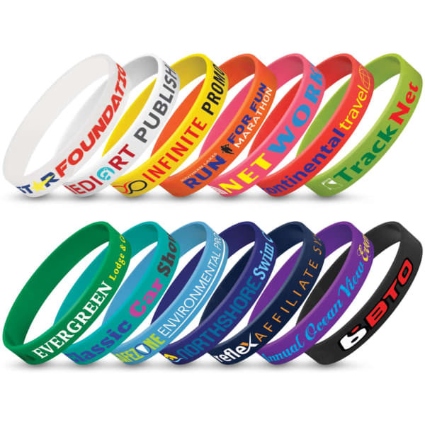 A collection of silicone wristbands in various colours, featuring different logos and text.