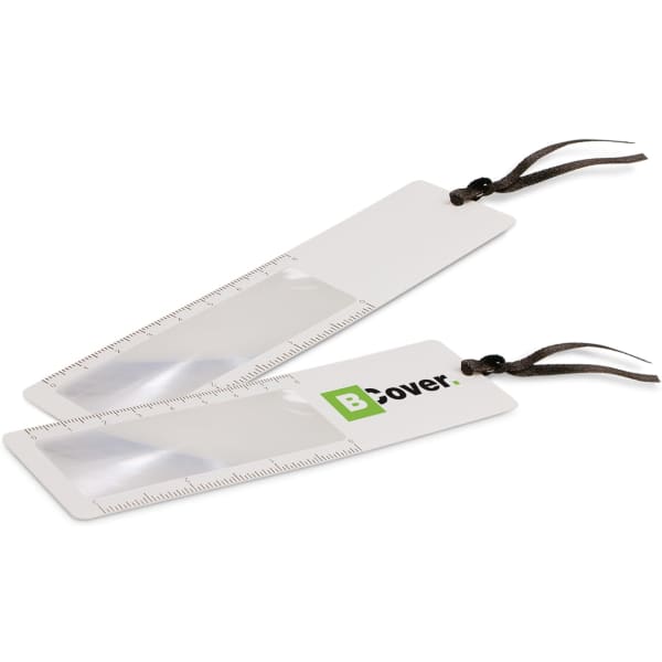 A white bookmark with a magnifying lens and a ruler, featuring a logo and a brown strap.