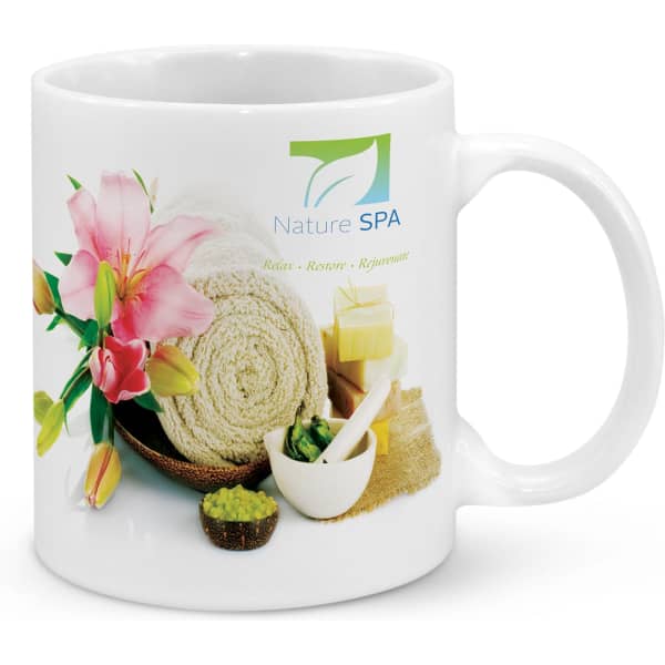 A white coffee mug featuring floral designs, towels, and spa items, with a logo on one side.