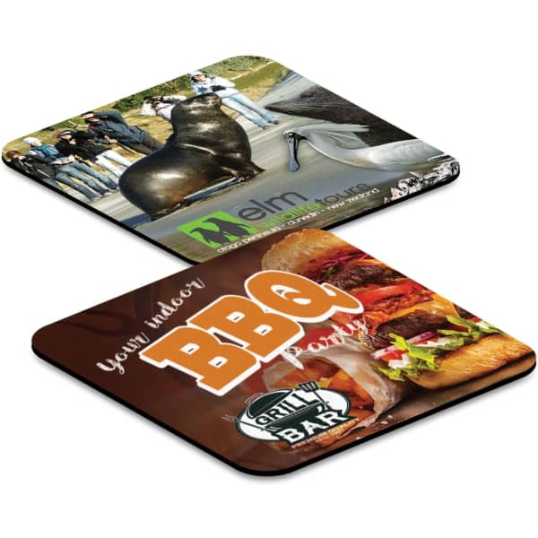 Two flexible coasters featuring colourful designs: one with a bull sculpture and the other depicting a BBQ grill theme.