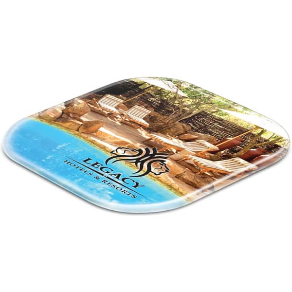 A square coaster featuring an image of a tranquil outdoor setting with a logo in black and a blue water section.