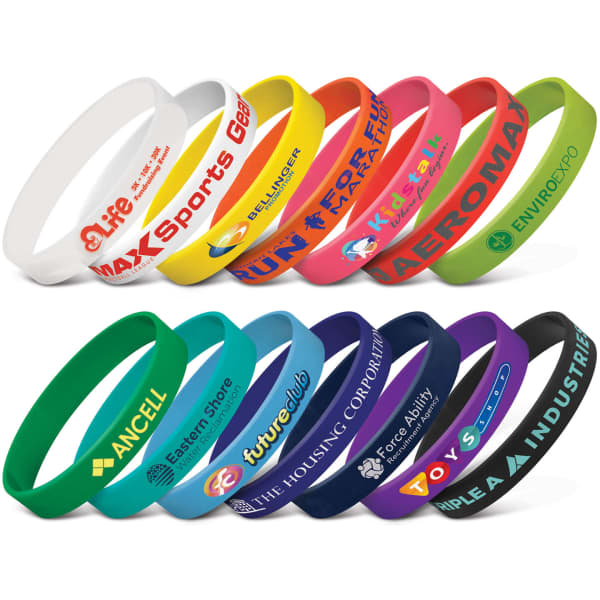 A collection of silicone wristbands in various colours, featuring multiple logos and promotional designs.